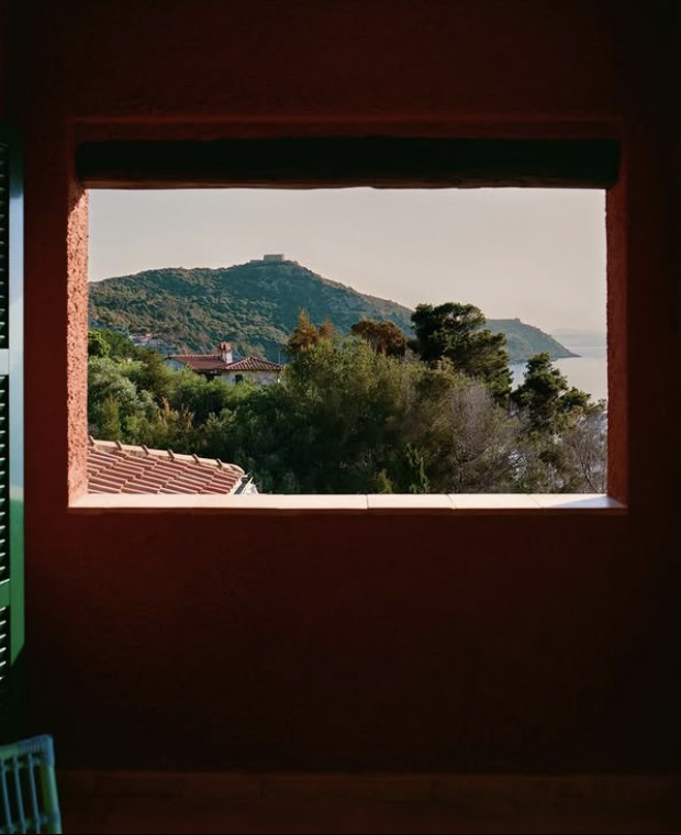 Woman with sunglasses walking down runway